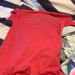 I’m selling a red shirt a Junior and a m sids shir
